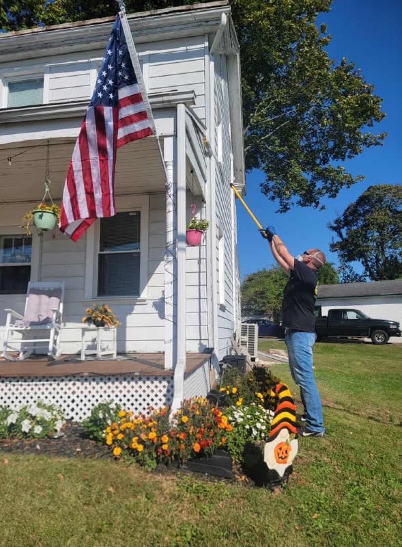 Douty's residential pest control technician treating a Williamsport, PA home
