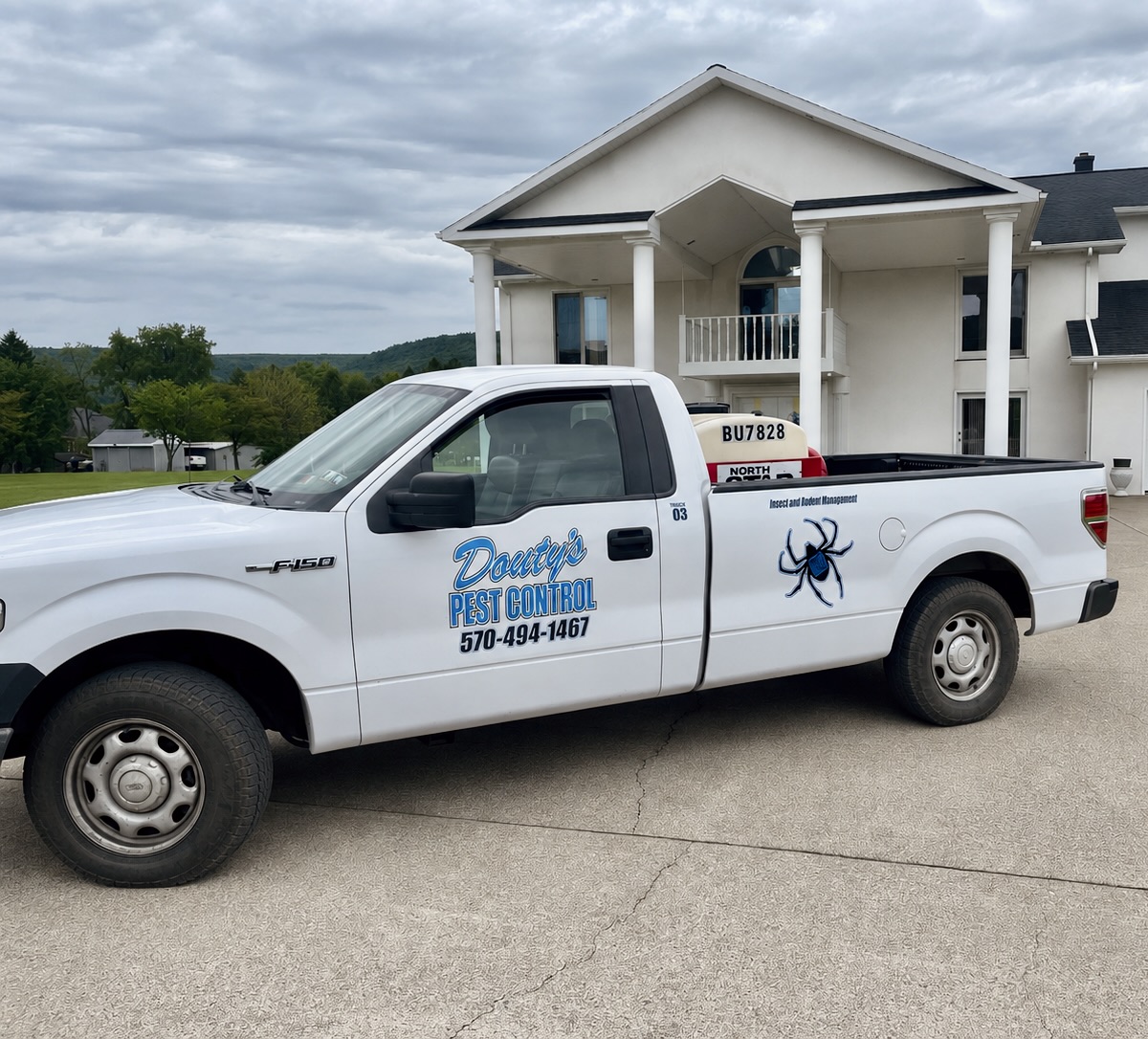 A Douty's Pest Control truck serving Bloomsburg, PA