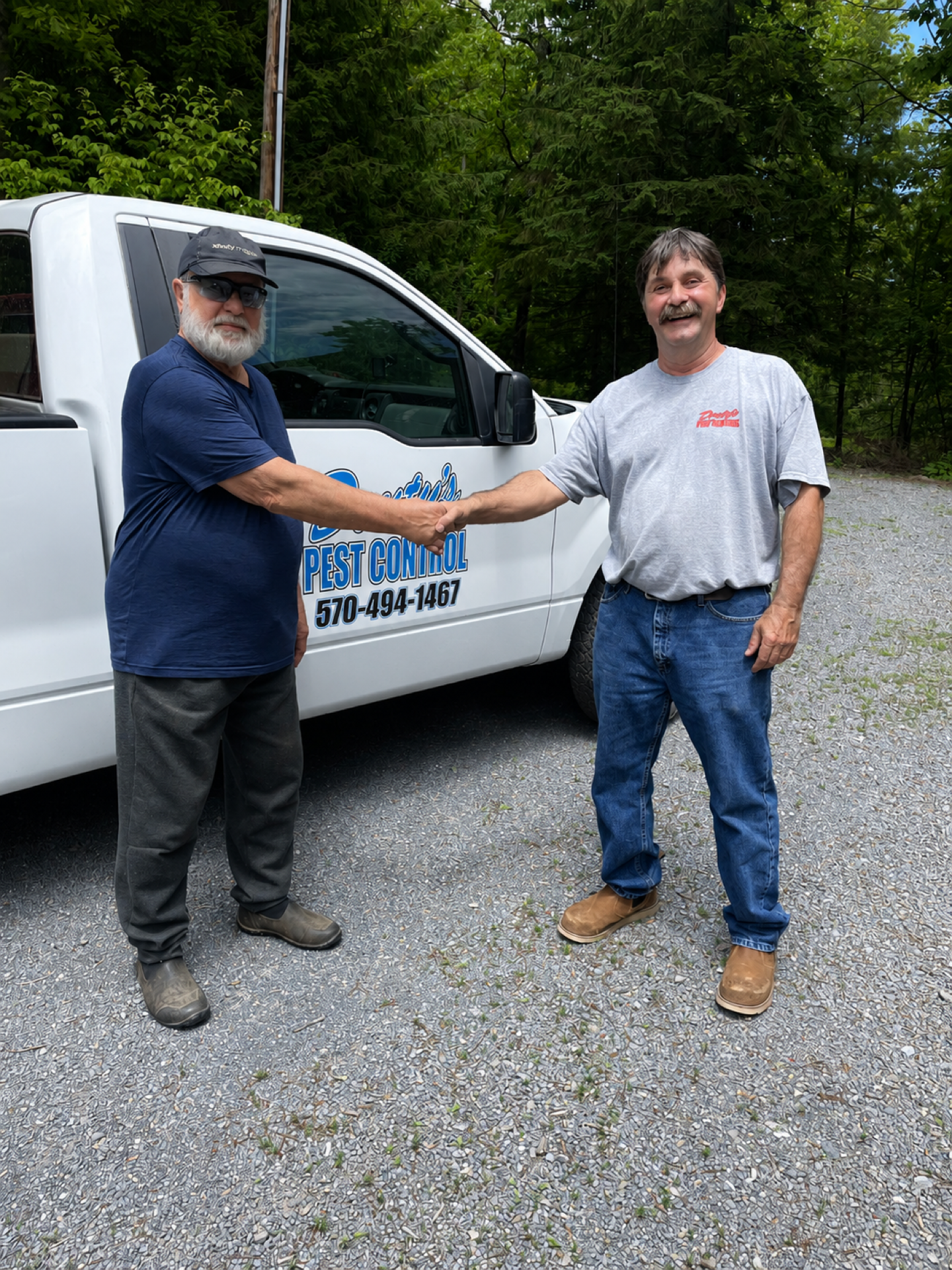 Douty's Pest Control technician greeting a Williamsport customer after rodent service