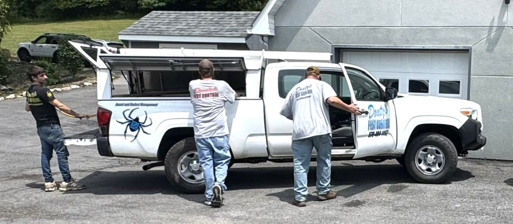 Douty's Pest Control technicians preparing a service truck for a termite job in Pennsylvania
