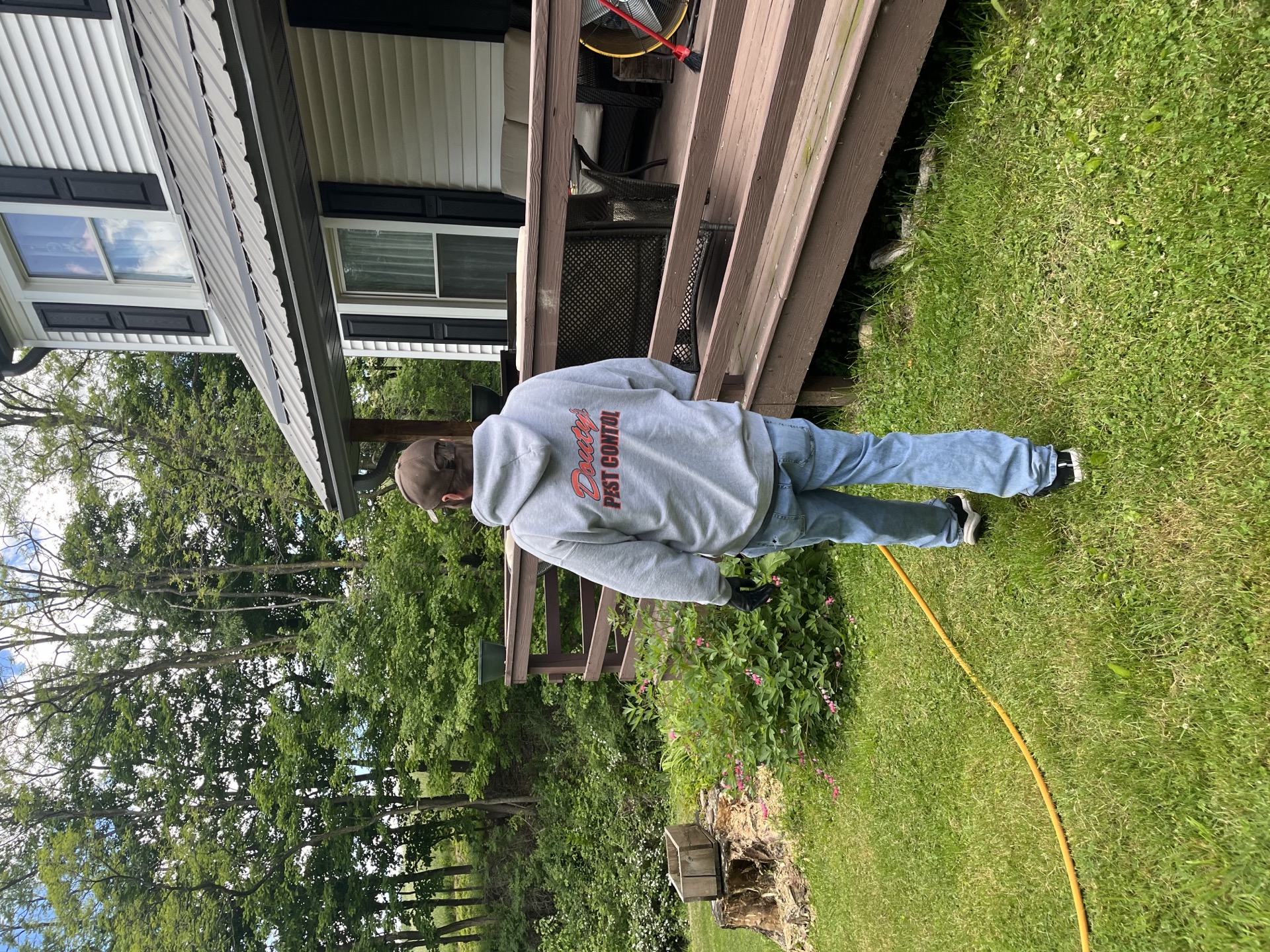 A Douty's Pest Control technician walking a property near Lewisburg, PA