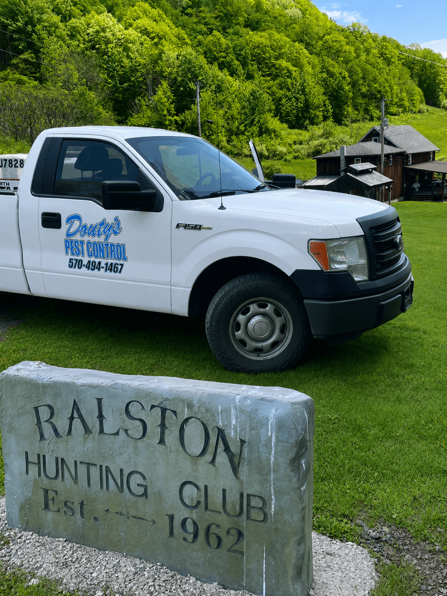 Douty's Pest Control truck on a Williamsport-area property